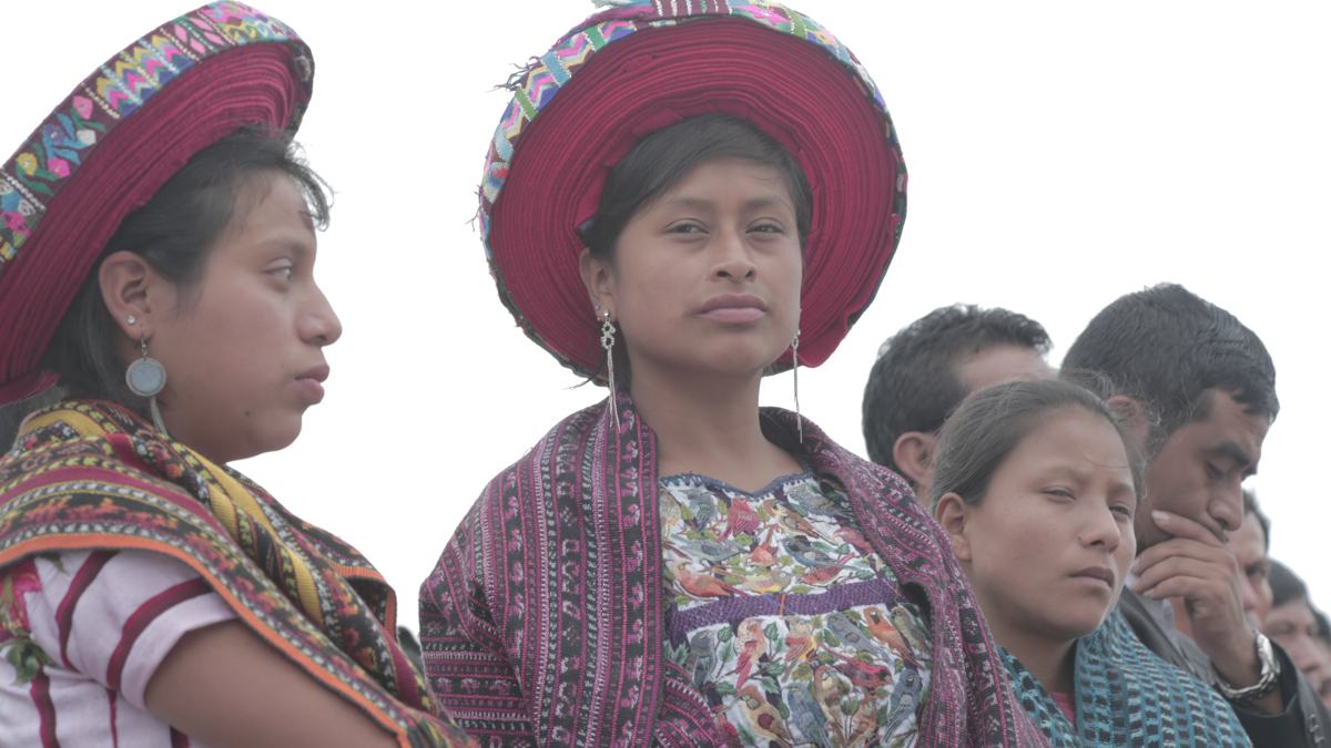 Women in coiled red headwraps